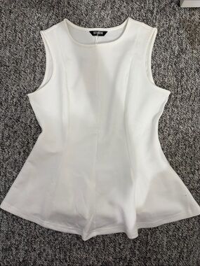 White Sleeveless Peplum Top